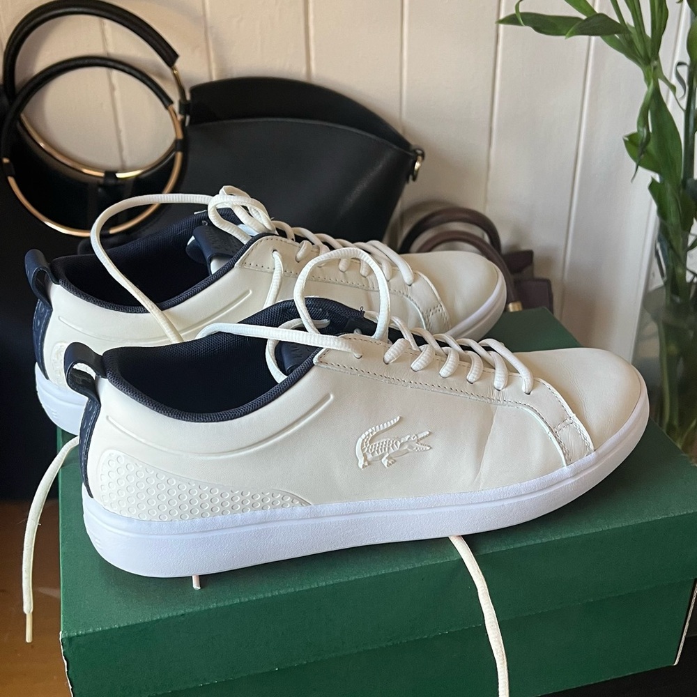 Like-new pair of Lacoste synthetic shoes.